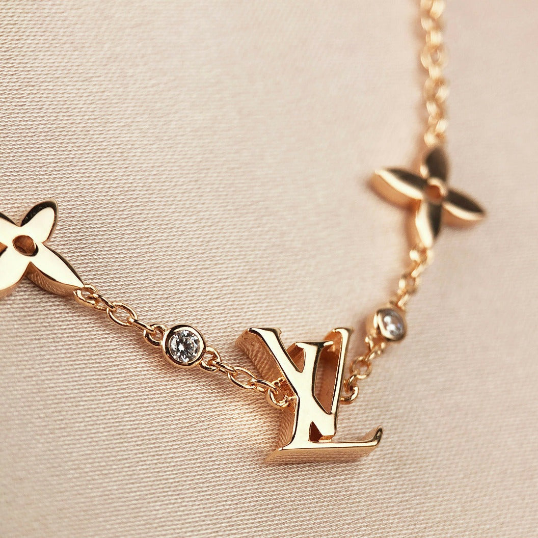 [VA]STAR AND SUN 7 MOTIFS GOLD BRACELET