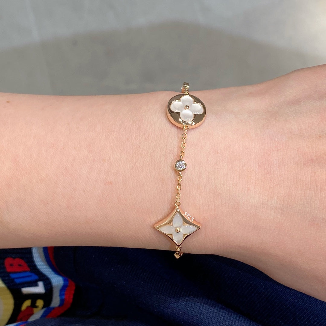 [VA]STAR AND SUN 4 MOTIF WHITE MOP PINK GOLD BRACELET
