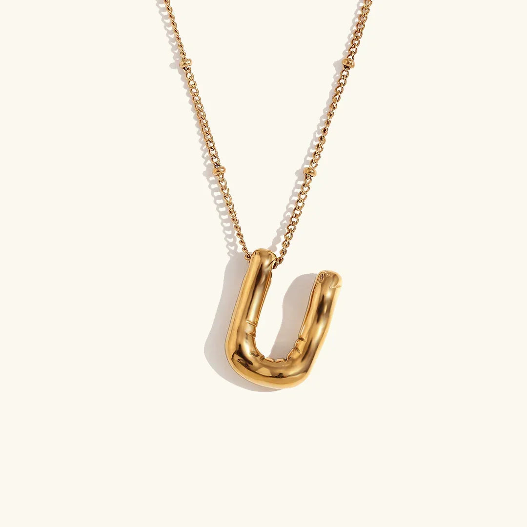 {
  "VA": "VA ヴァンドーム青山 ゴールドイニシャルネックレス"
}